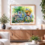 Finished spring floral bicycle cross stitch artwork displayed