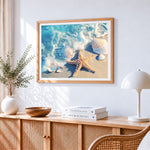 Starfish and seashells on beach cross stitch artwork displayed on wall as home decor