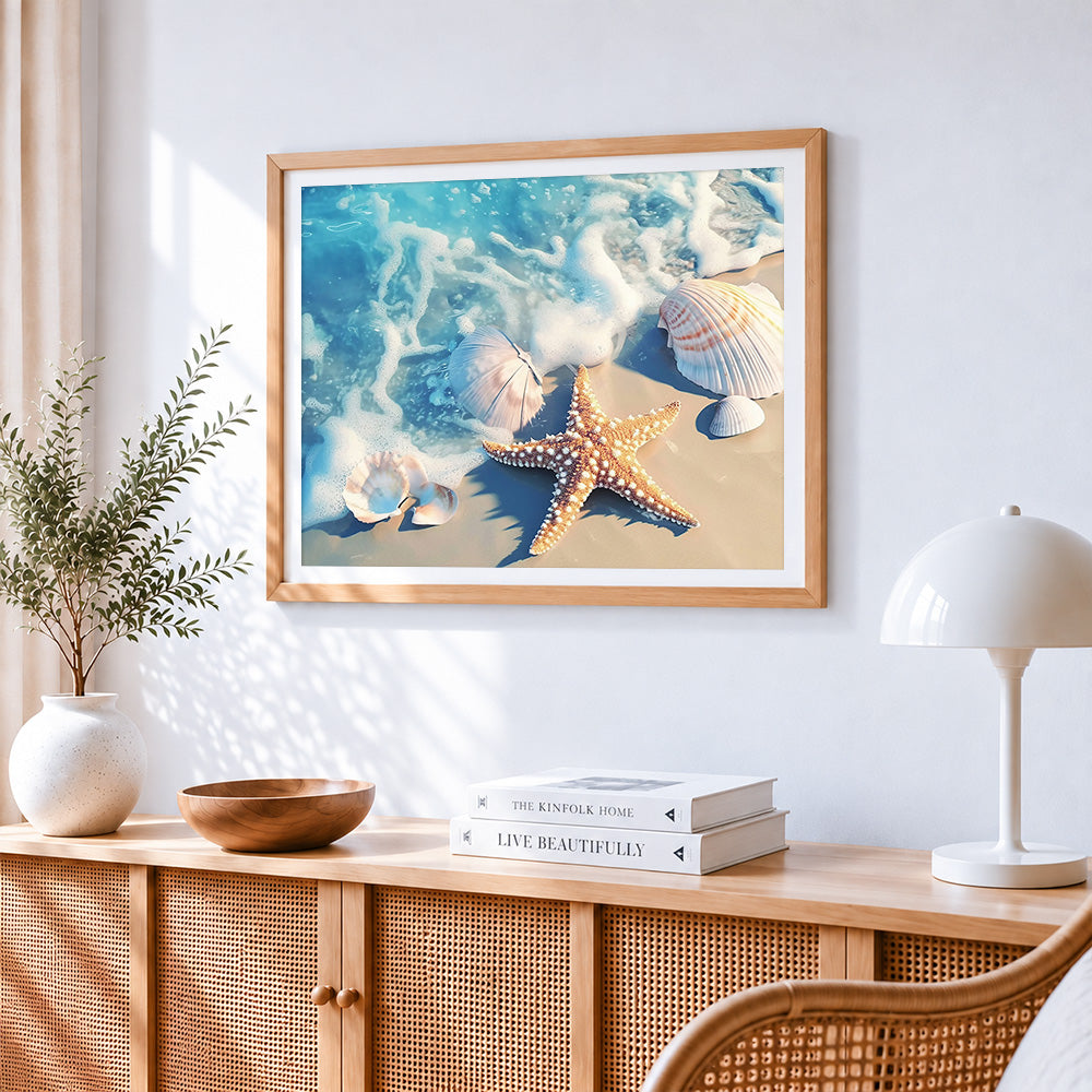 Starfish and seashells on beach cross stitch artwork displayed on wall as home decor