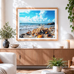 Finished starfish and shells on sandy beach cross stitch artwork displayed