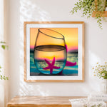 Finished starfish in glass with sunset] cross stitch artwork displayed