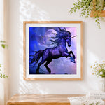 Finished starlight unicorn in a cosmic sky cross stitch artwork displayed