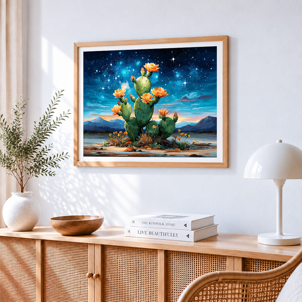 Starry night cactus cross stitch artwork displayed on wall as home decor