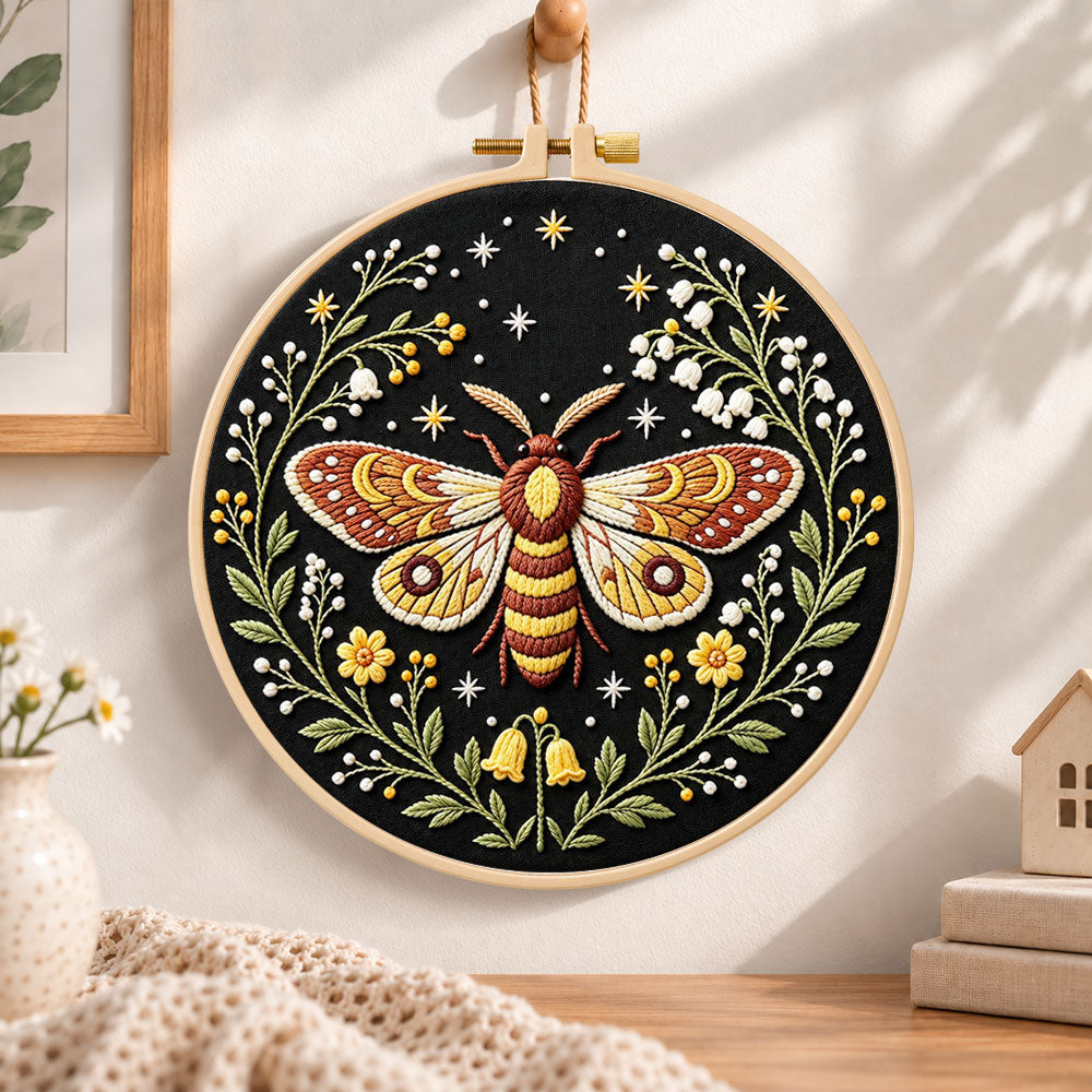 Starry night moth embroidery hoop wall art displayed as warm and cosy handmade home decor
