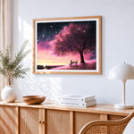 Starry night pink tree cross stitch artwork displayed on wall as home decor