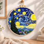 Starry night sky embroidery hoop wall art displayed as warm and cozy handmade home decor