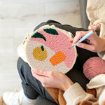 Creating handmade still life fruit and object punch needle artwork