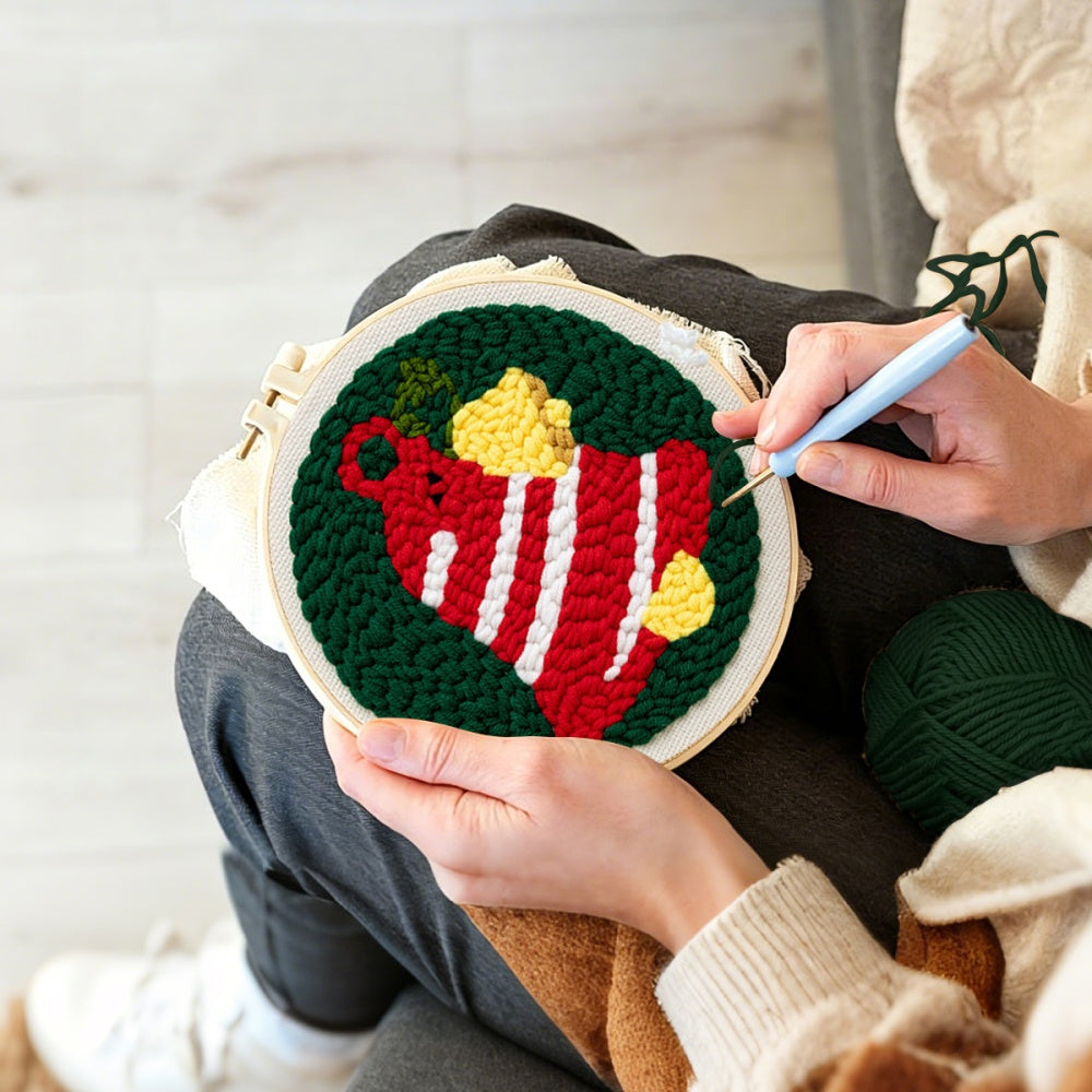 Creating handmade striped christmas bell unch needle artwork