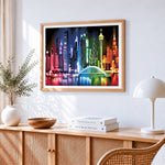 Stylised colourful cityscape cross stitch artwork displayed on wall as home decor