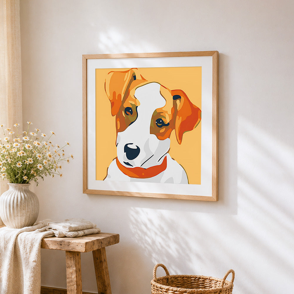 Stylised jack russell terrier cross stitch artwork displayed on wall as home decor