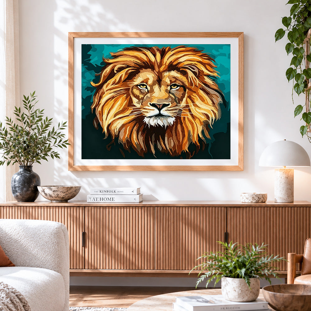 Finished stylised lion head cross stitch artwork displayed