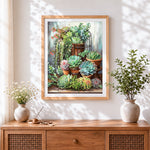 Finished succulents in terracotta pots cross stitch artwork displayed