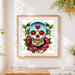 Finished sugar skull with heart eyes and roses cross stitch artwork displayed