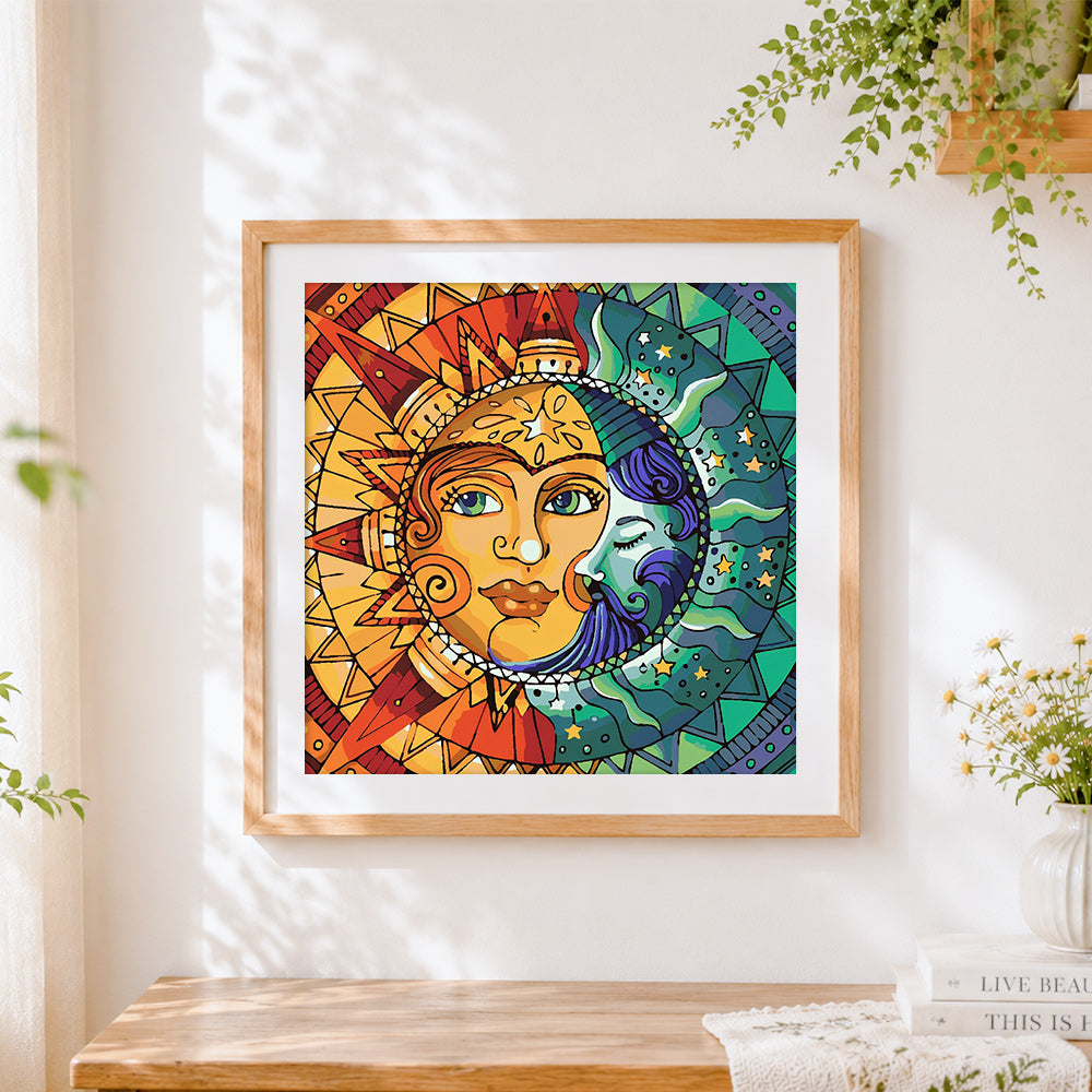 Finished sun and moon mandala cross stitch artwork displayed