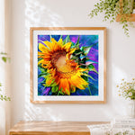 Finished sunflower on colourful abstract background cross stitch artwork displayed