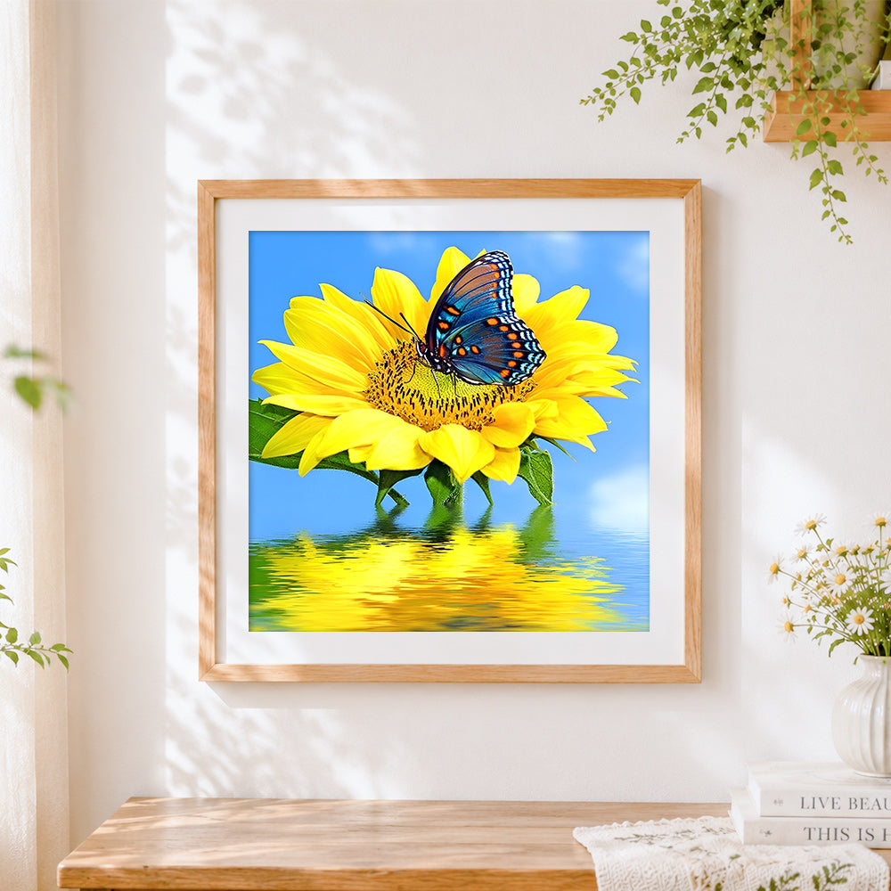 Finished sunflower with blue butterfly on water cross stitch artwork displayed