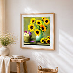 Sunflowers and envelopes cross stitch artwork displayed on wall as home decor