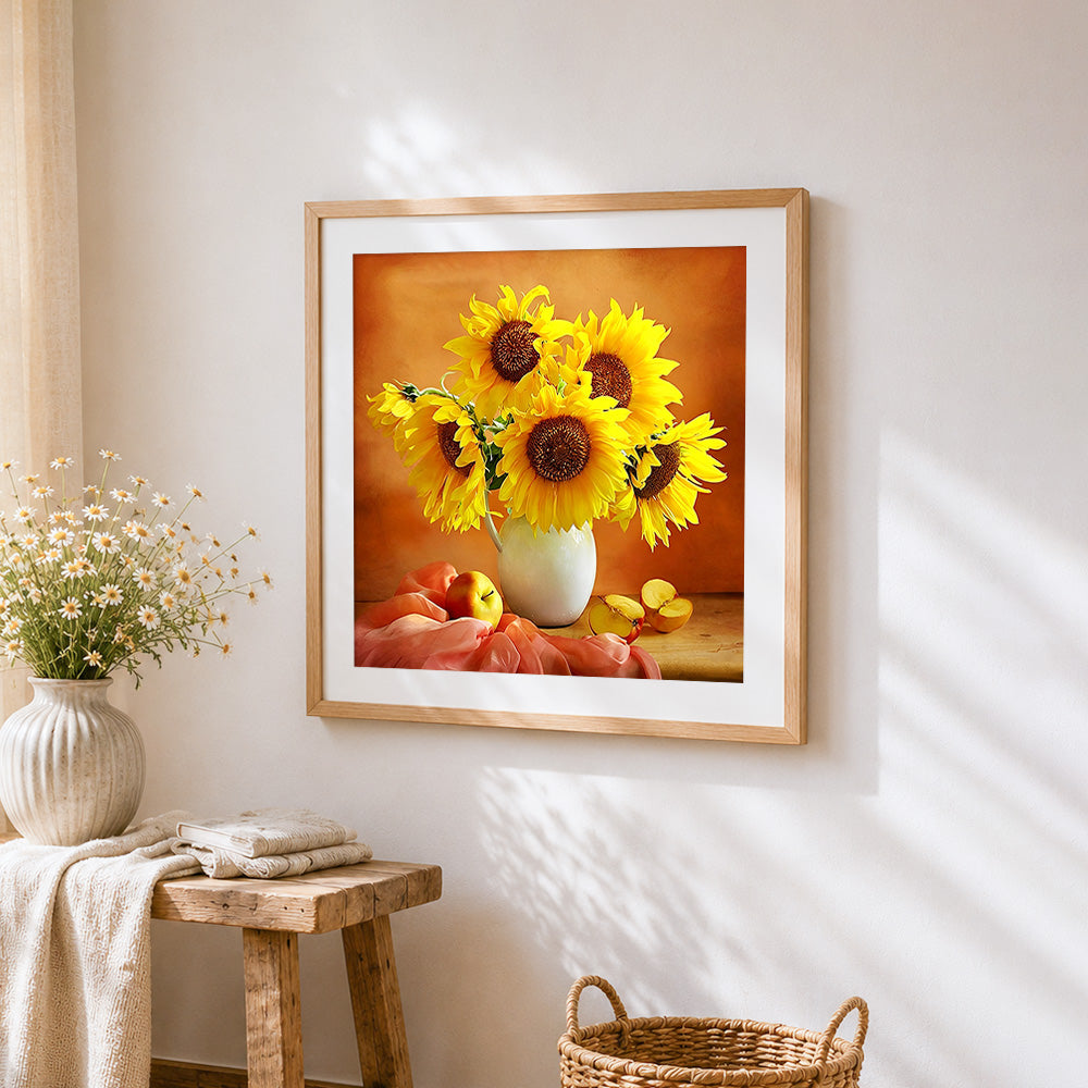 Sunflowers in a white jug with apples cross stitch artwork displayed on wall as home decor