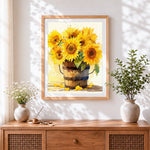 Finished sunflowers in a wooden bucket cross stitch artwork displayed