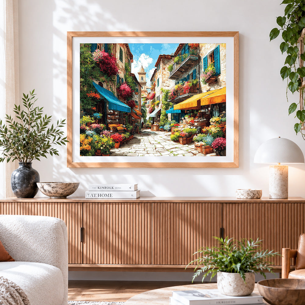 Finished sunlit flower market street cross stitch artwork displayed