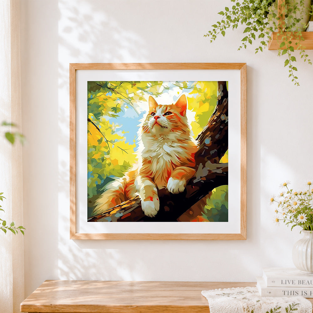 Finished sunlit ginger cat in a tree cross stitch artwork displayed