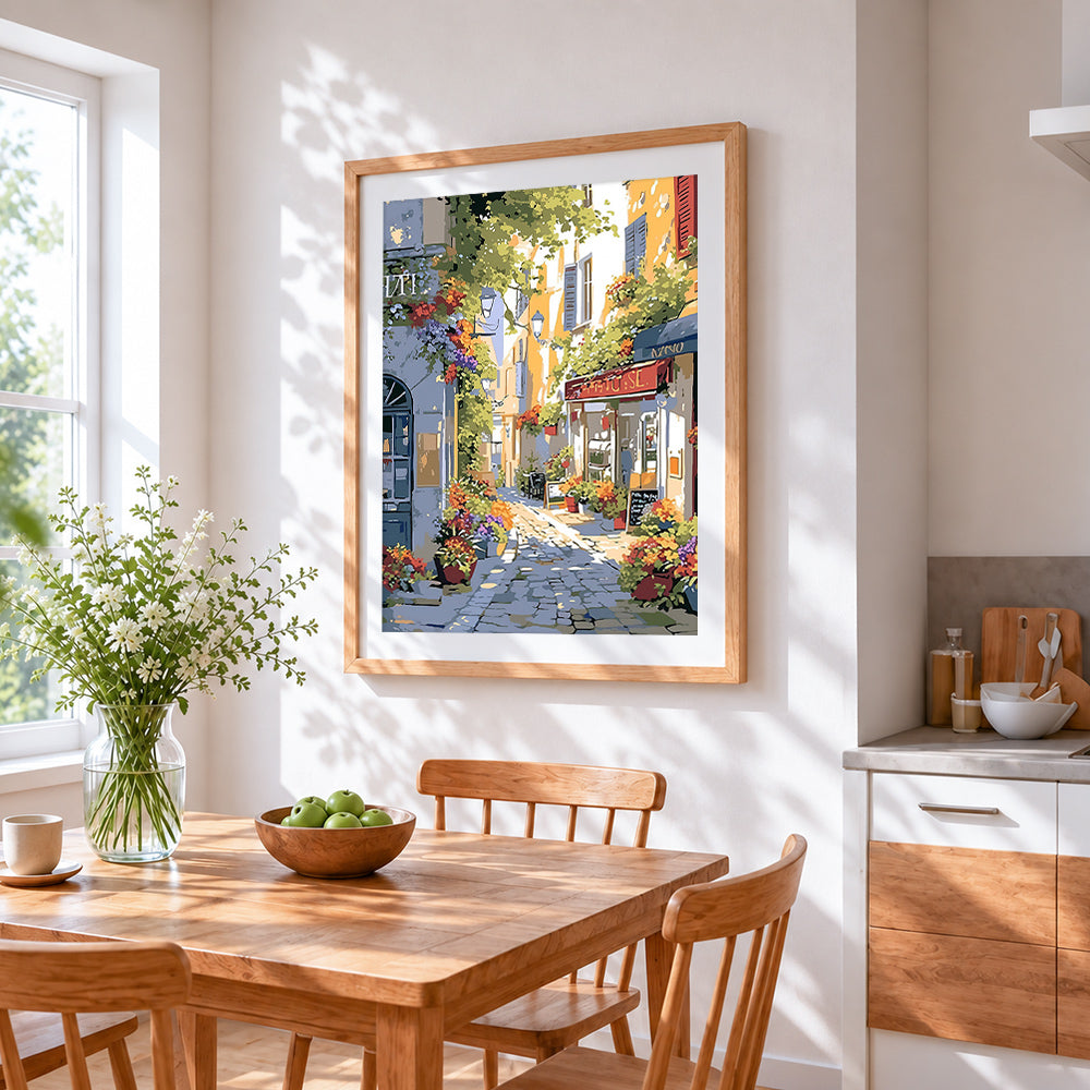 Sunlit italian cafe street cross stitch artwork displayed on wall as home decor