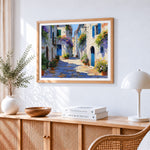 Sunlit mediterranean alleyway cross stitch artwork displayed on wall as home decor