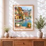 Finished Sunlit waterside café with flowers cross stitch artwork displayed
