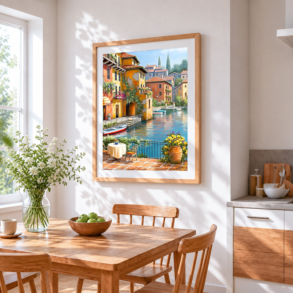 Sunlit waterside café with flowers cross stitch artwork displayed on wall as home decor