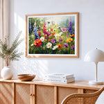 Sunlit wildflower meadow cross stitch artwork displayed on wall as home decor