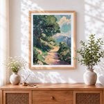 Finished sunlit woodland path cross stitch artwork displayed