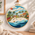 Sunny tropical beach embroidery hoop wall art displayed as warm and cosy handmade home decor