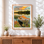 Finished sunset lake boat cross stitch artwork displayed