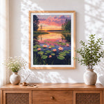 Finished sunset lake with water lilies cross stitch artwork displayed