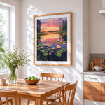 Sunset lake with water lilies cross stitch artwork displayed on wall as home decor