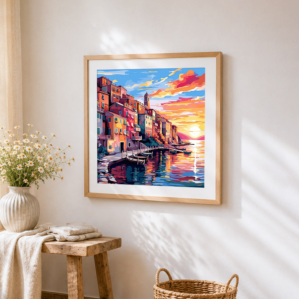 Sunset over cinque terre cross stitch artwork displayed on wall as home decor
