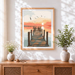 Finished sunset pier with seagulls cross stitch artwork displayed