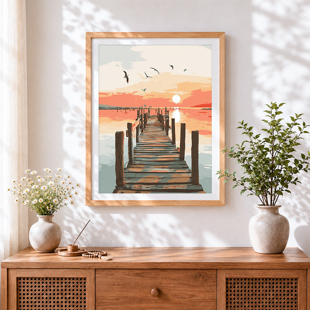 Finished sunset pier with seagulls cross stitch artwork displayed