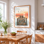 Sunset pier with seagulls cross stitch artwork displayed on wall as home decor