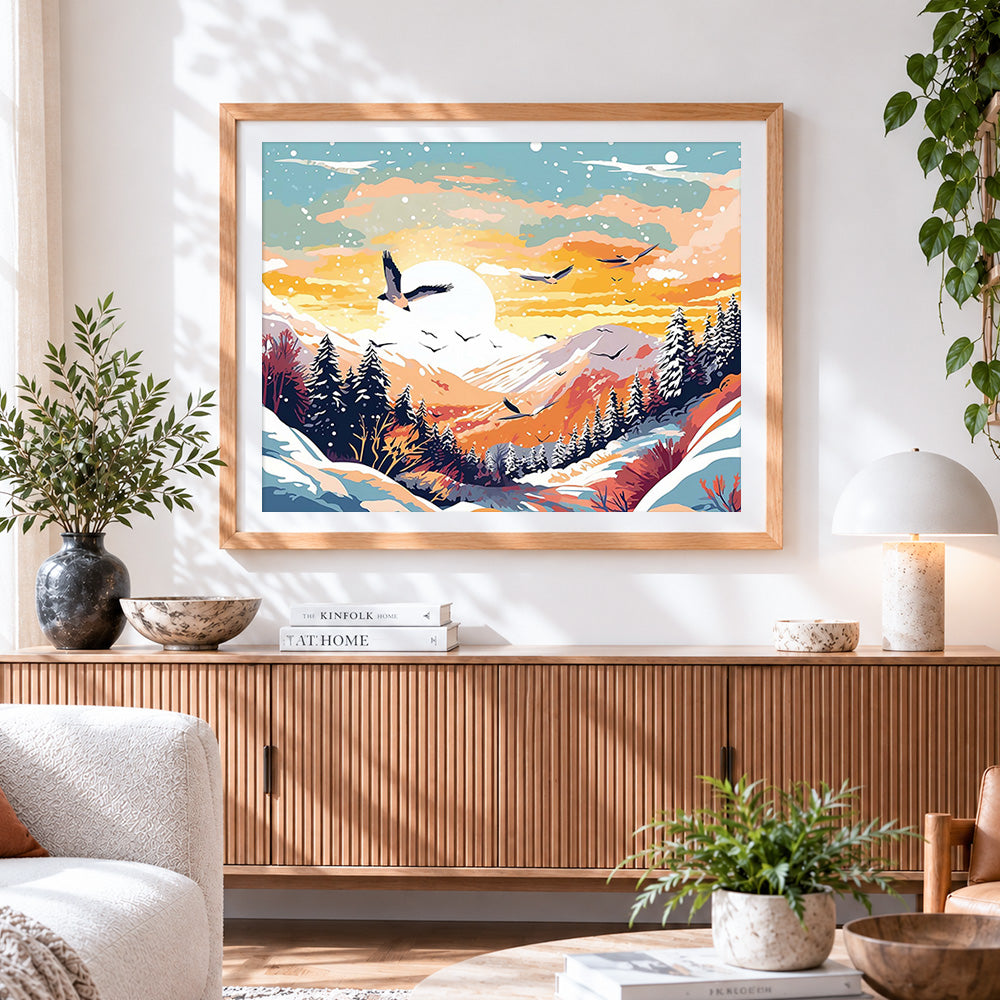 Finished sunset snowy mountains and birds cross stitch artwork displayed