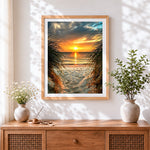 Finished sunset through beach and grass cross stitch artwork displayed