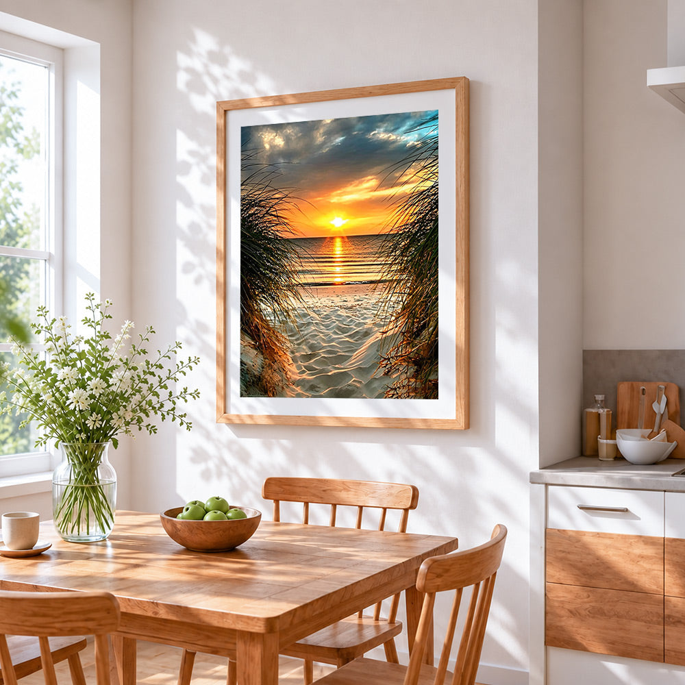 Sunset through beach and grass cross stitch artwork displayed on wall as home decor