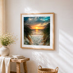 Sunset through beach dune grass cross stitch artwork displayed on wall as home decor