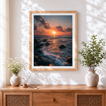 Finished sunset waves crashing on rocky shore cross stitch artwork displayed