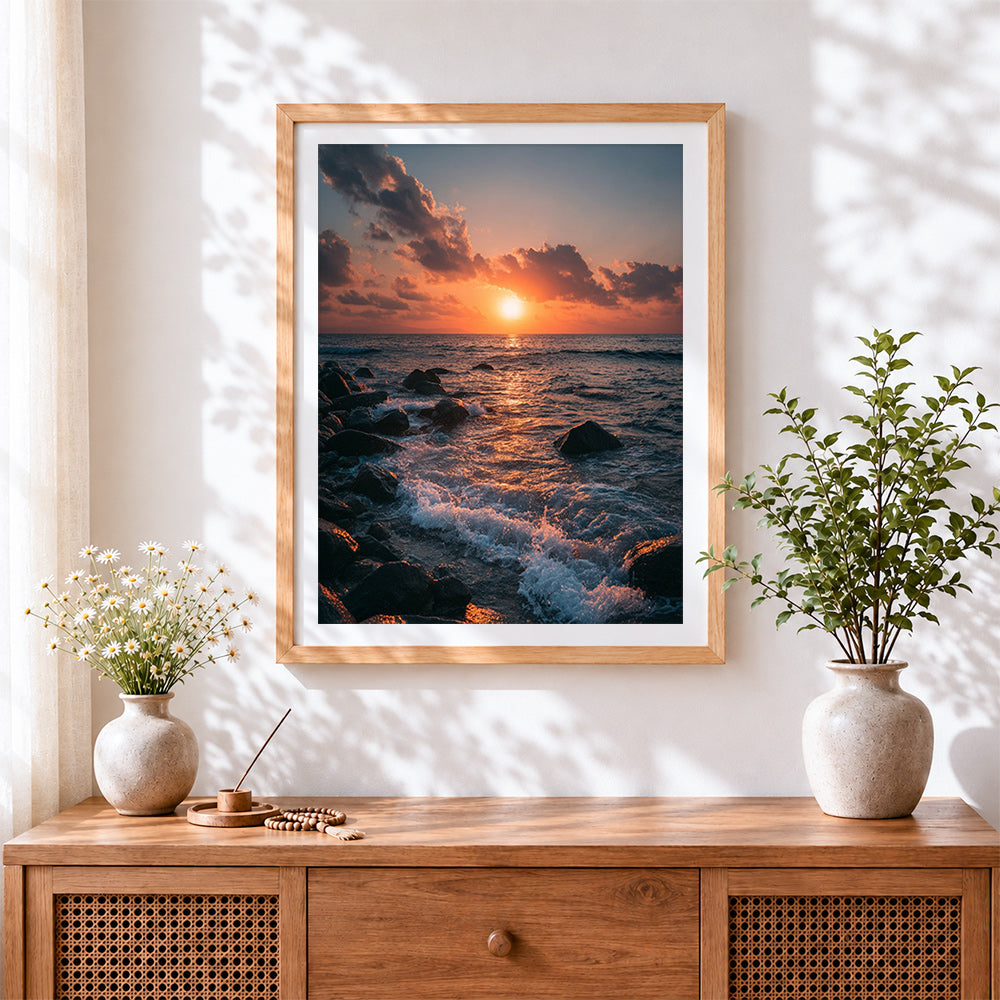 Finished sunset waves crashing on rocky shore cross stitch artwork displayed