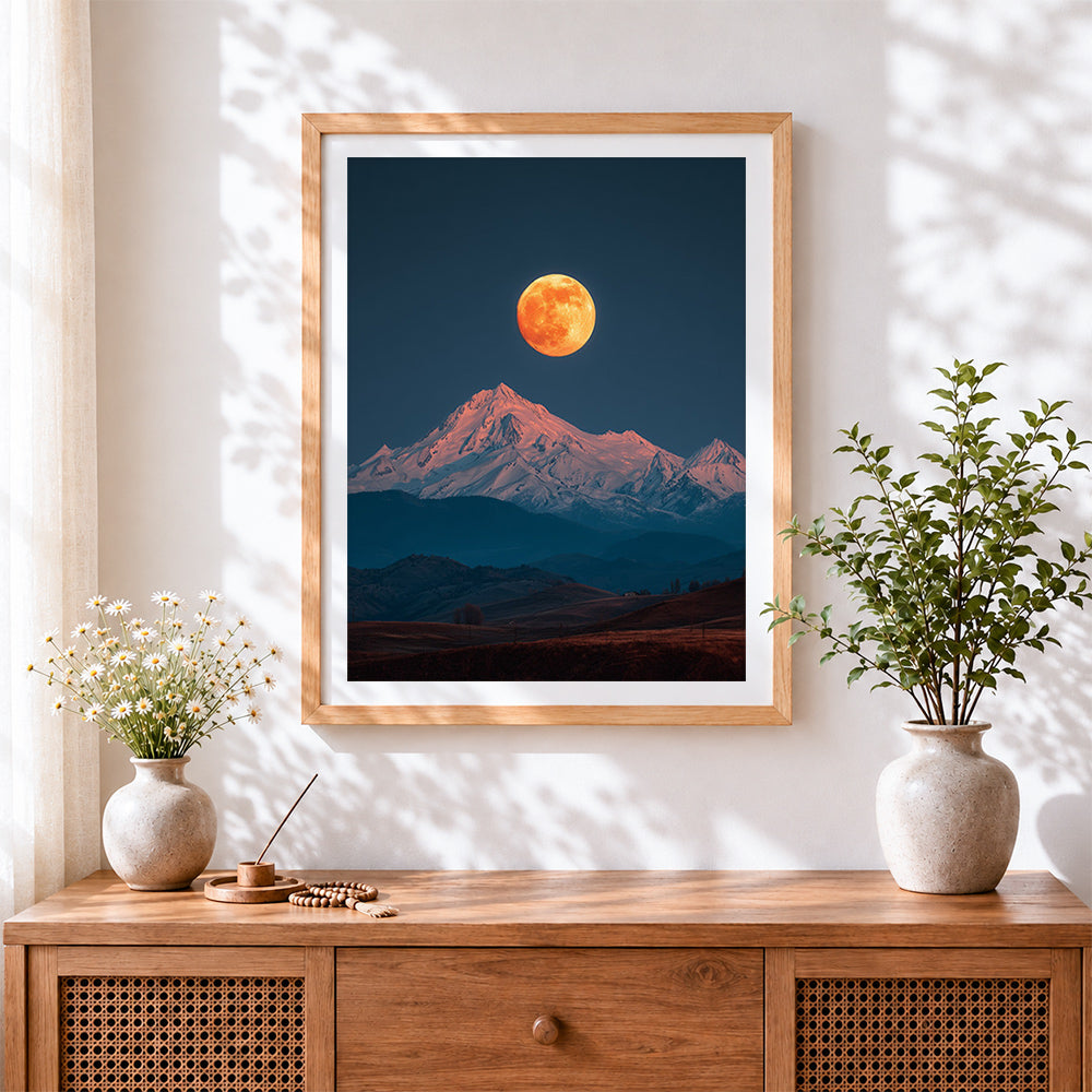 Finished super moon over snowy mountain cross stitch artwork displayed