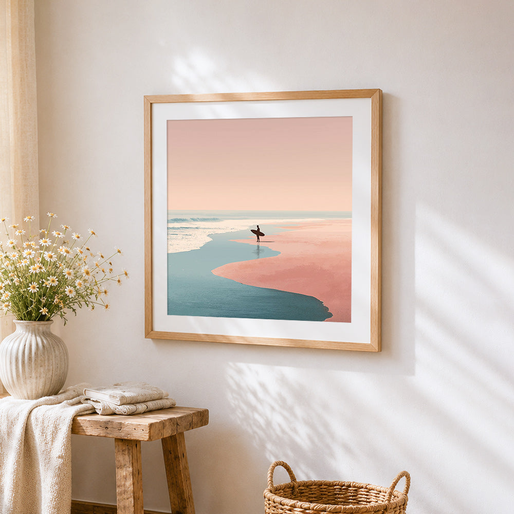Surfer on a pink sand beach cross stitch artwork displayed on wall as home decor