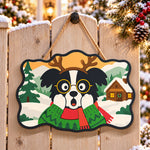 Surprised reindeer dog paint by numbers door hanger on a garden gate