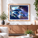 Finished surreal dolphins in cosmic frame cross stitch artwork displayed