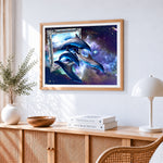 Surreal dolphins in cosmic frame cross stitch artwork displayed on wall as home decor